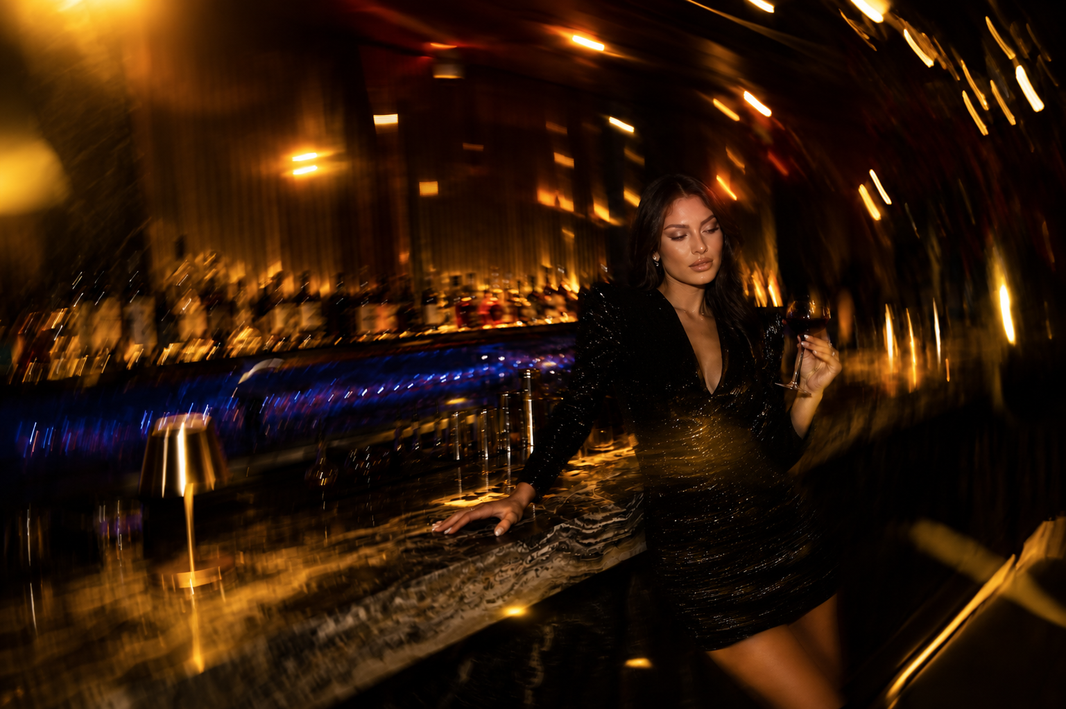 Inside The Royce — a low-lit lounge, warm tones, the long evening.